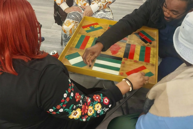 People playing board games at Tuesday link up