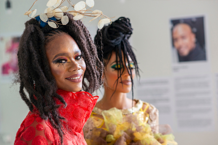 Two women dressed up at an exhibition