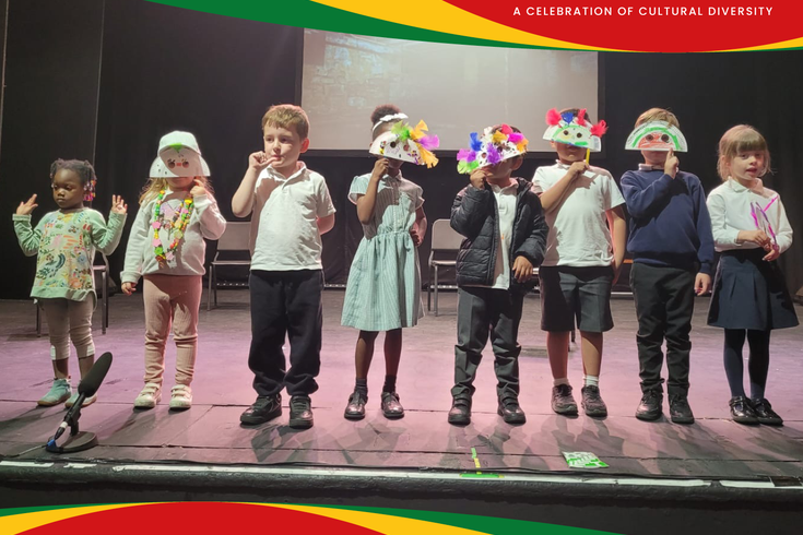 Children with masks on stage