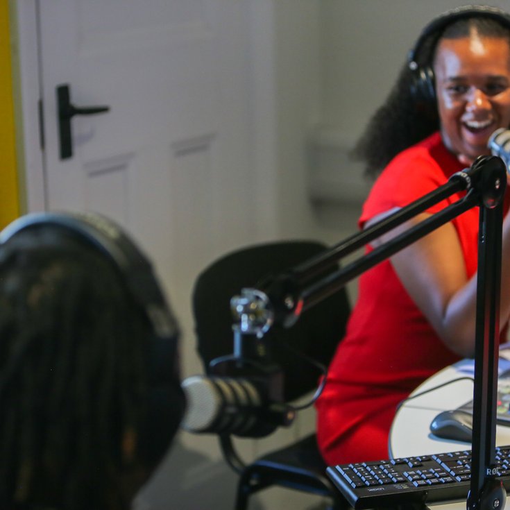 A young radio presenter chats to a guest on Radio Lewisham
