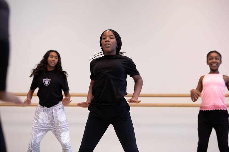 A group of young people dancing.