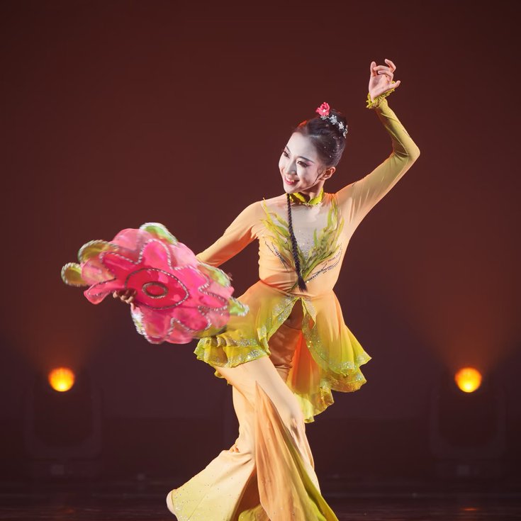 Costumed dancer performing Chinese Handkerchief Dance