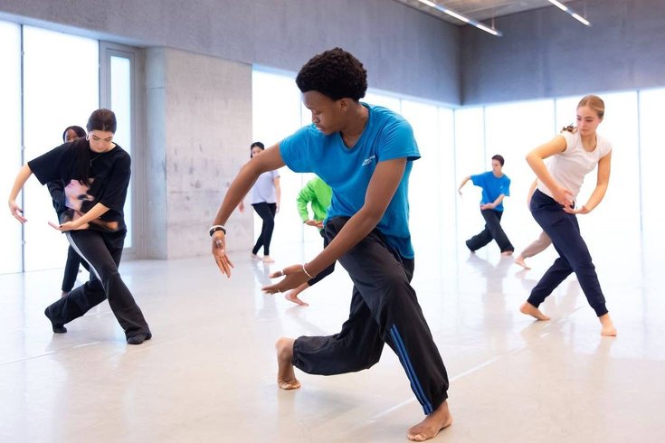 A group of young people dancing.