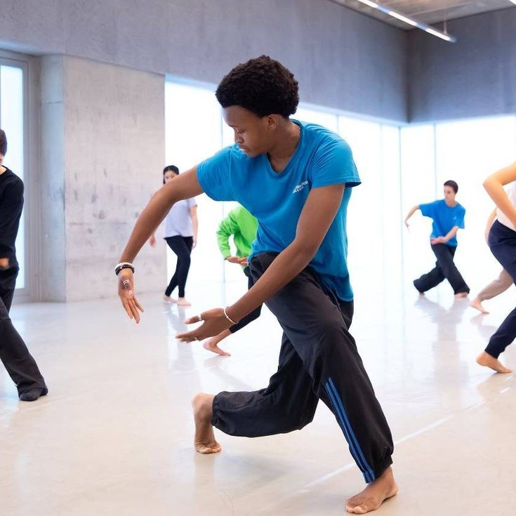 A group of young people dancing.