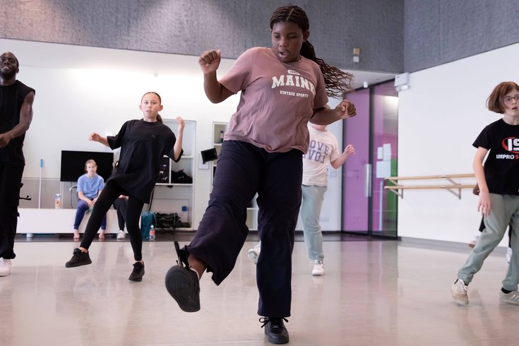 A group of children dancing.