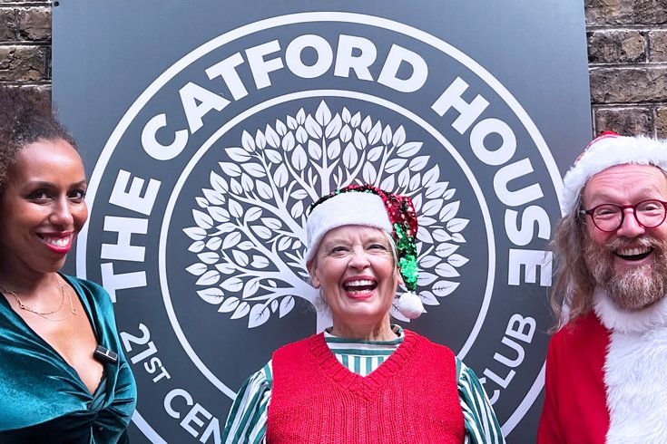 Santa, an Elf and Mrs Claus outside Catford House