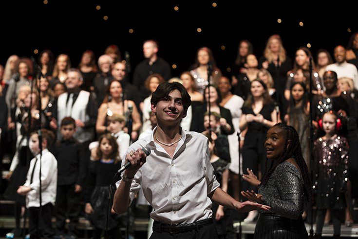 A number of people performing on stage