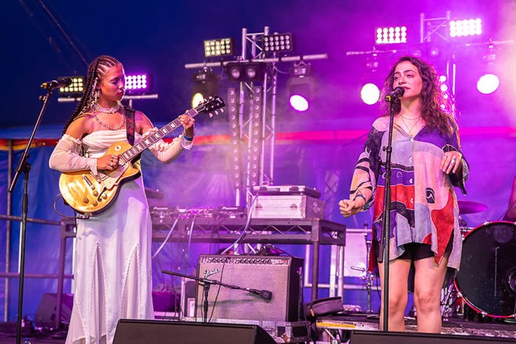 Two female musicians performing at People's Day on stage