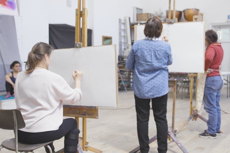 Adult art students working