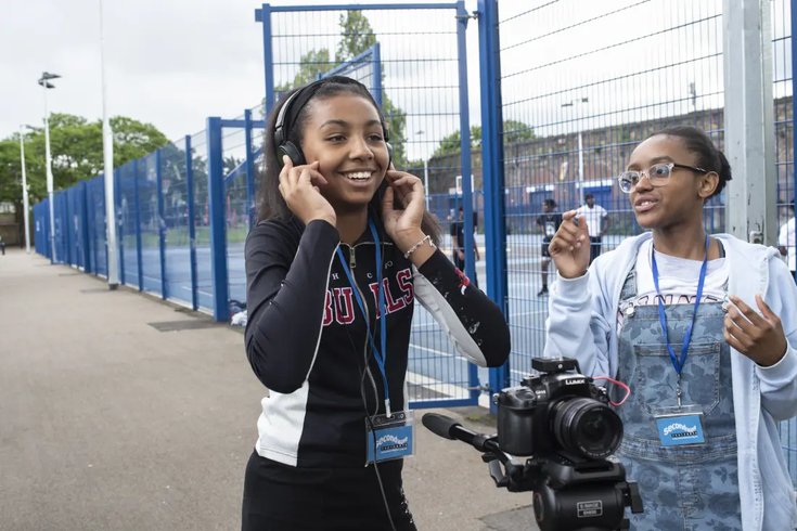 Young women filming documentary in Deptford