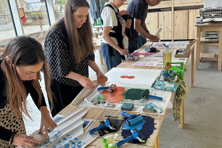 attendees at a linoprint making workshop