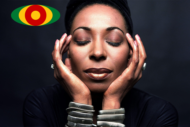 Woman closing eyes and hands to head