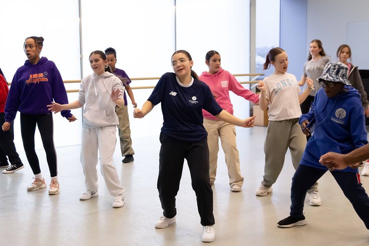 A group of young people dancing.
