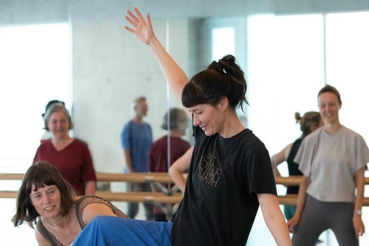 A group of people dancing.