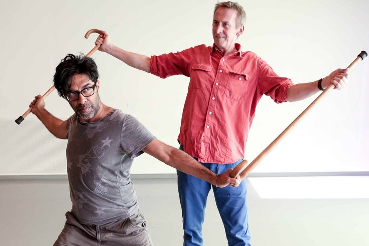 Two men dancing.