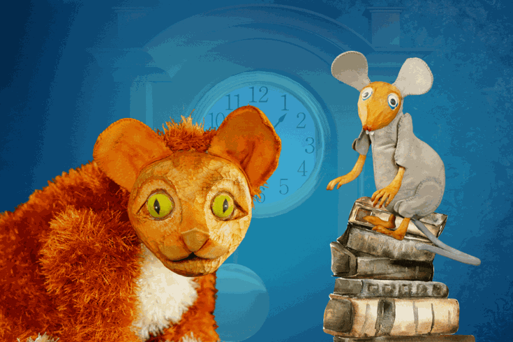Ginger Cat and a mouse sitting on a pile of books with a clock in the background
