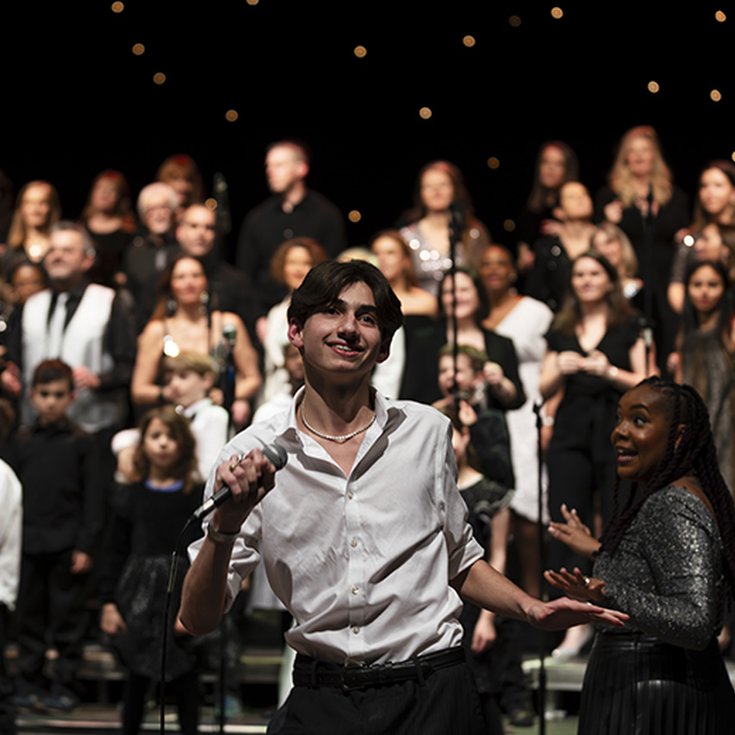 A number of people performing on stage
