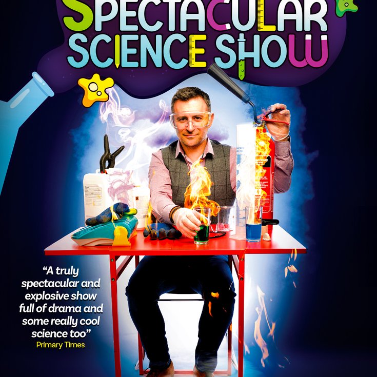 Mark Thompson sat at a science table with lots of science equipment