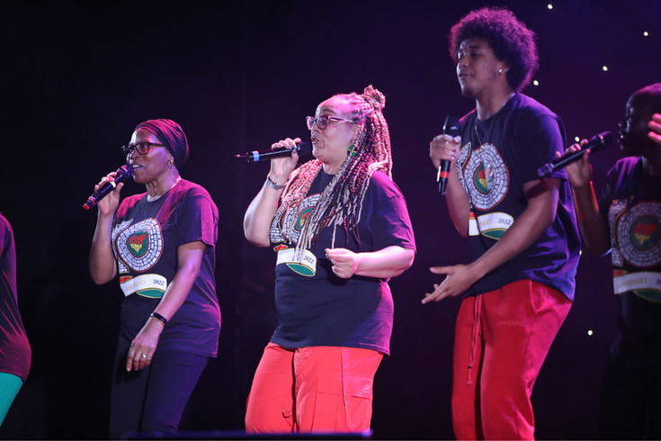 Three singers on stage