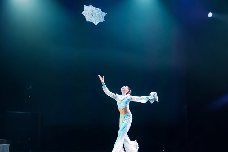 Costumed dancer performing Chinese Handkerchief Dance