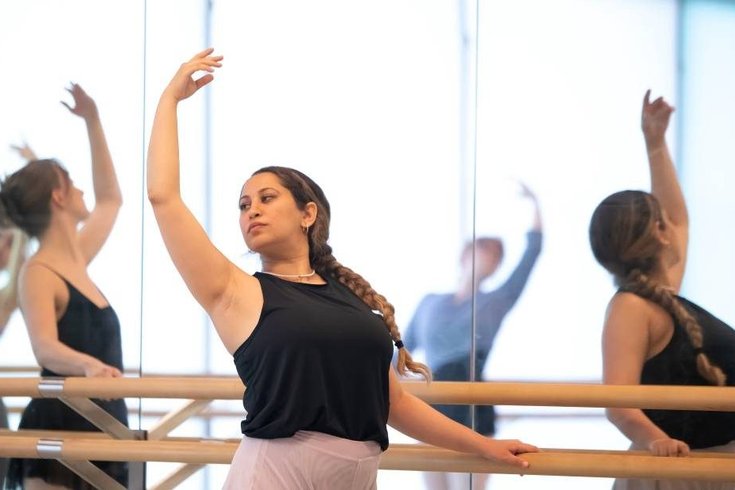 A group of people dancing.