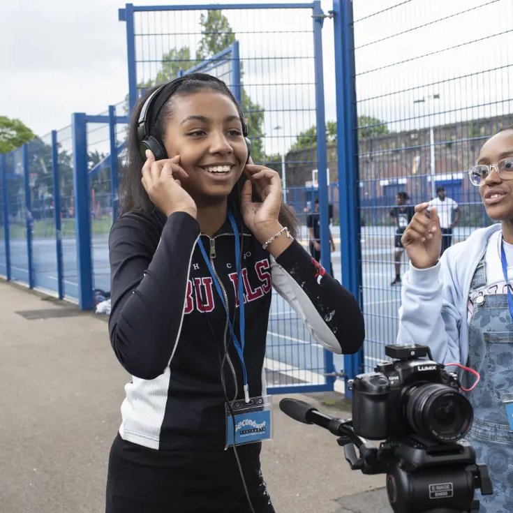 Young women filming documentary in Deptford