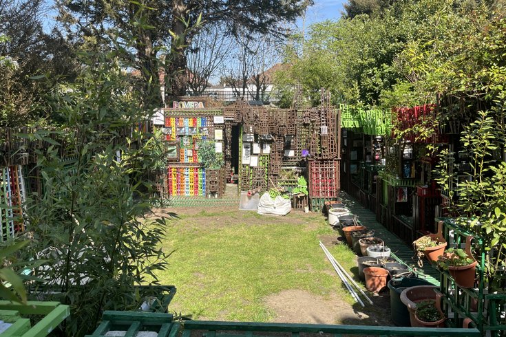 Image from a distance pf Povera Shed and the garden