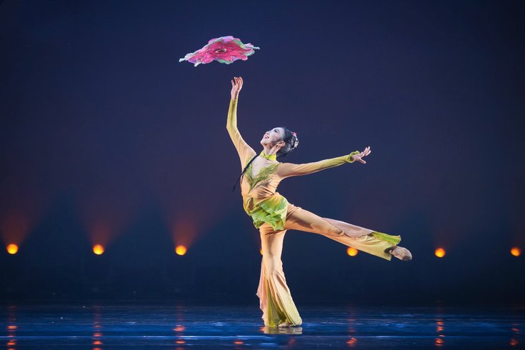 Costumed dancer performing Chinese Handkerchief Dance