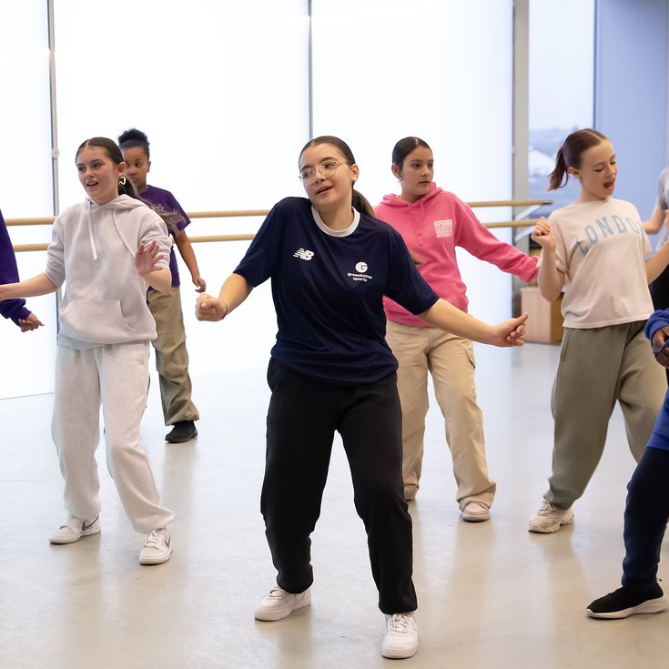 A group of young people dancing.