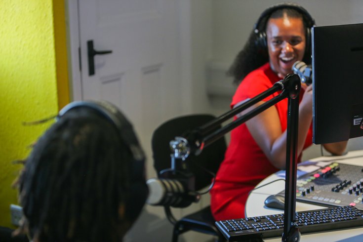 A young radio presenter chats to a guest on Radio Lewisham