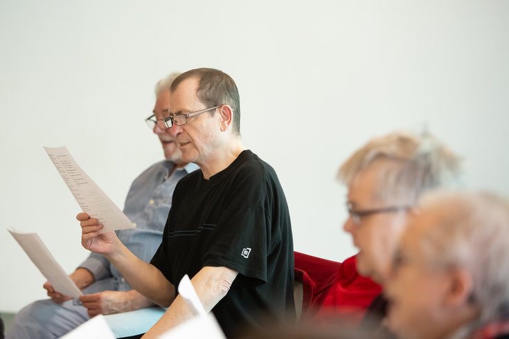 photo of people in a choir singing