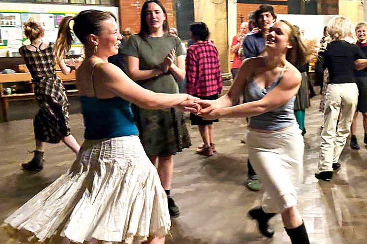 A room full of people dancing from a previous Box of Delights Ceilidh Band event.