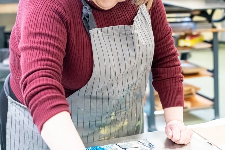 Women doing lino printing