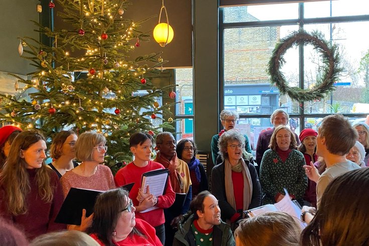 The Quaggy Community Choir singing at the FUSS Christmas Fair 2024