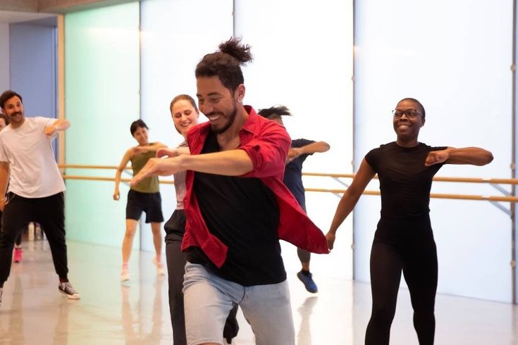 A group of people dancing.