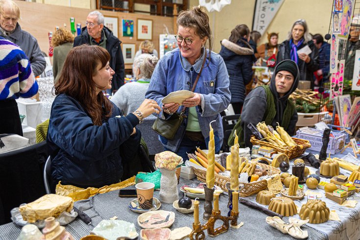 Stall holders chatting at an xmas market