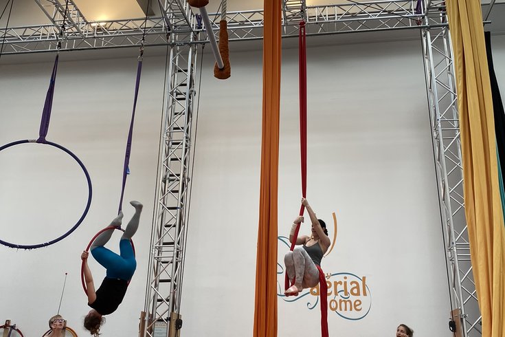 Adults on aerial hoops and silks at My Aerial Home