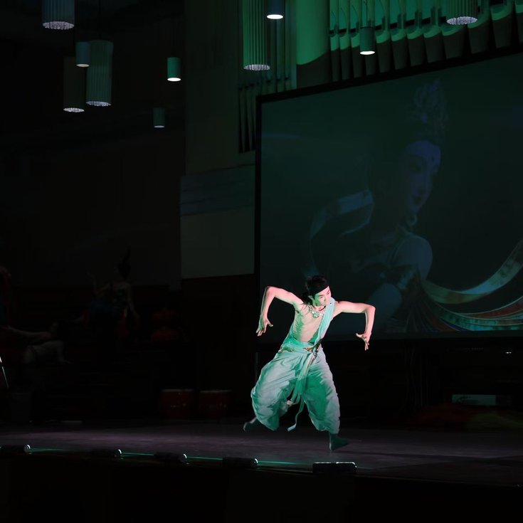 Costumed dancer performing Chinese Dunhuang Dance