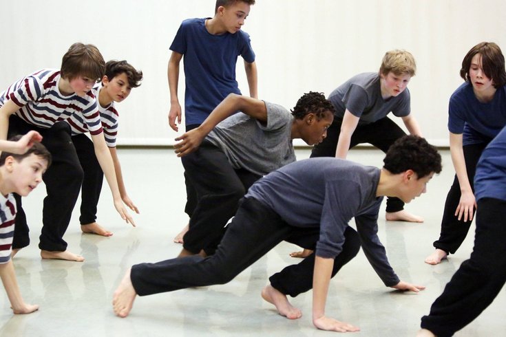 A group of young people dancing.