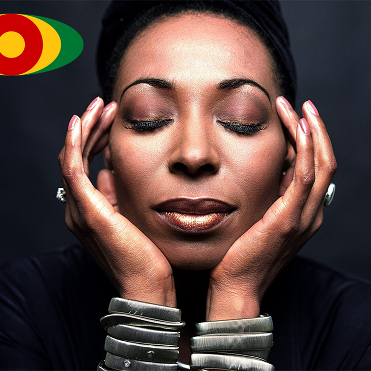 Woman closing eyes and hands to head