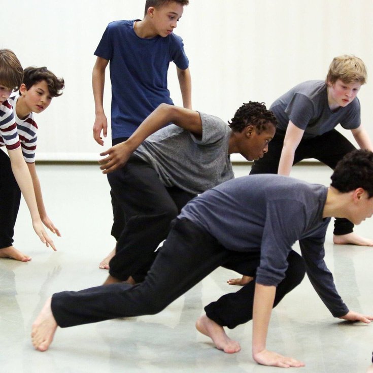 A group of young people dancing.