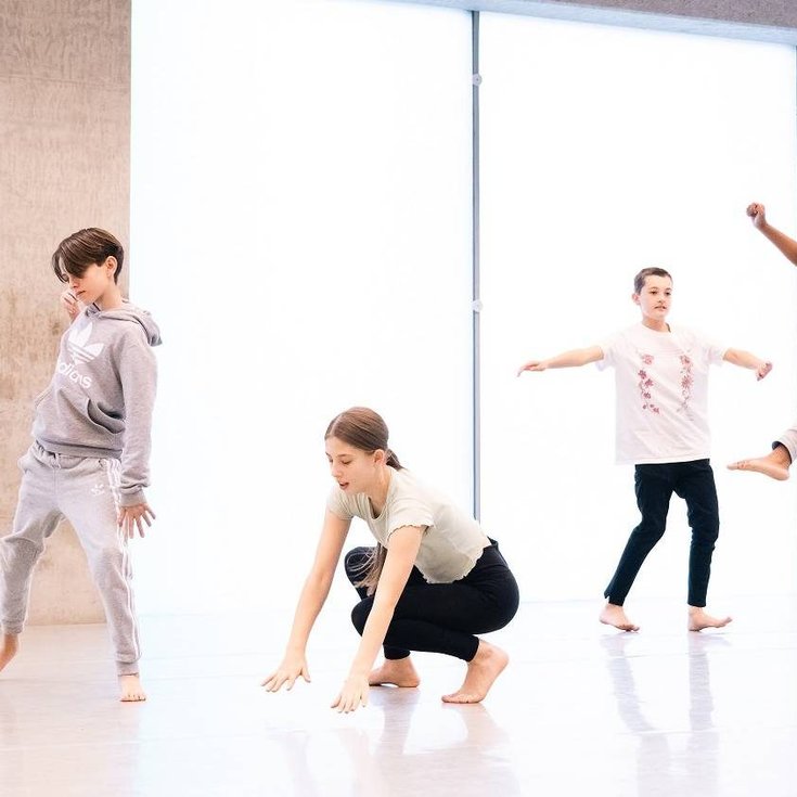 A group of young people dancing.