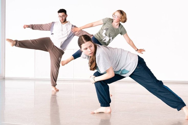 A group of young people dancing.