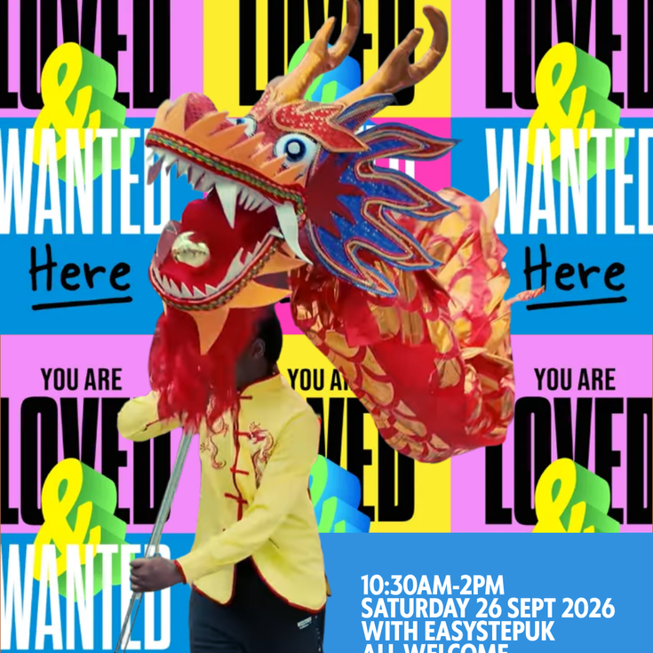 Dragon dancer with the head of the dragon, behind are Love & Wanted posters to mark the occasion. Everyone is love and wanted here.