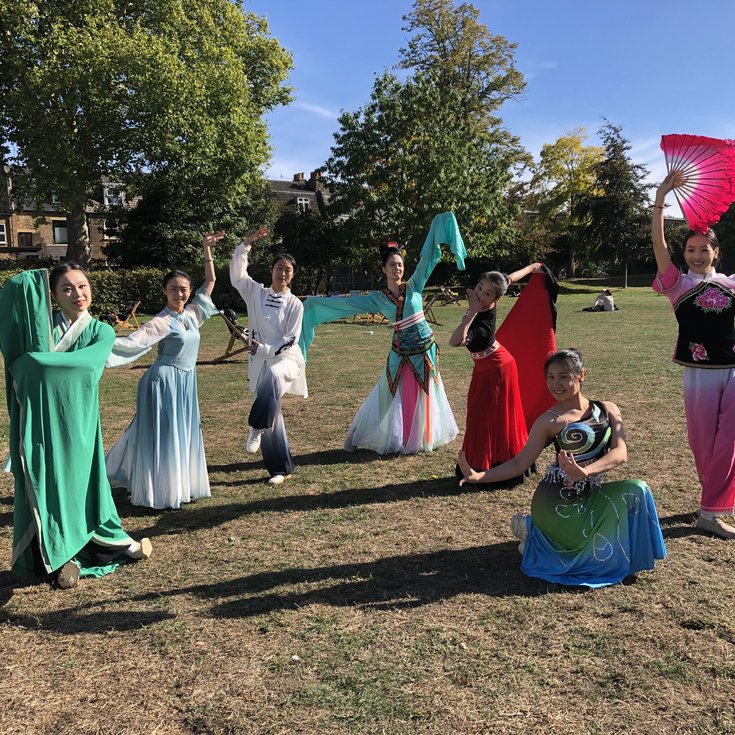 7 Costumed dancers posing in the styles of various Chinese Dance